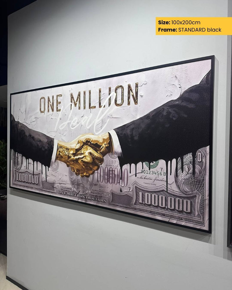 Framed artwork of two hands shaking with a gold handshake on a $100 bill background.