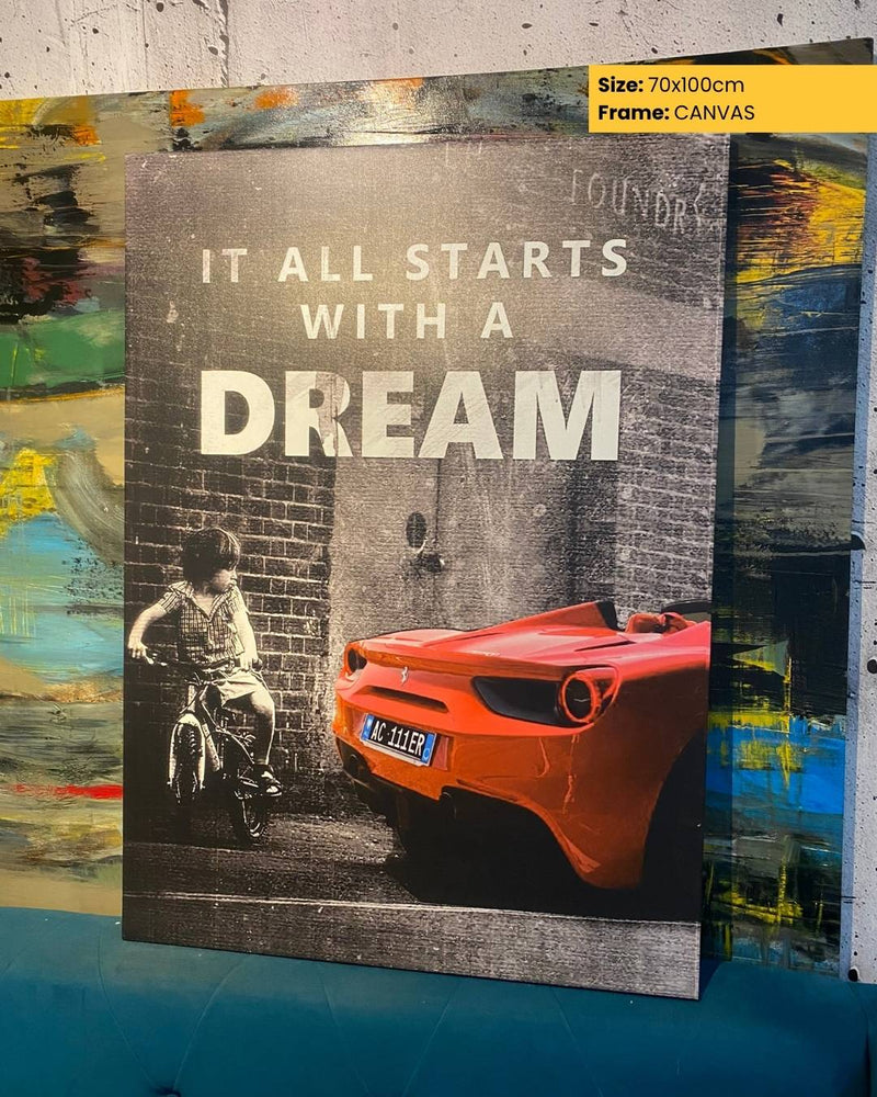 Canvas print with a motivational quote 'It all starts with a dream' and a child on a bike and red car graphic.