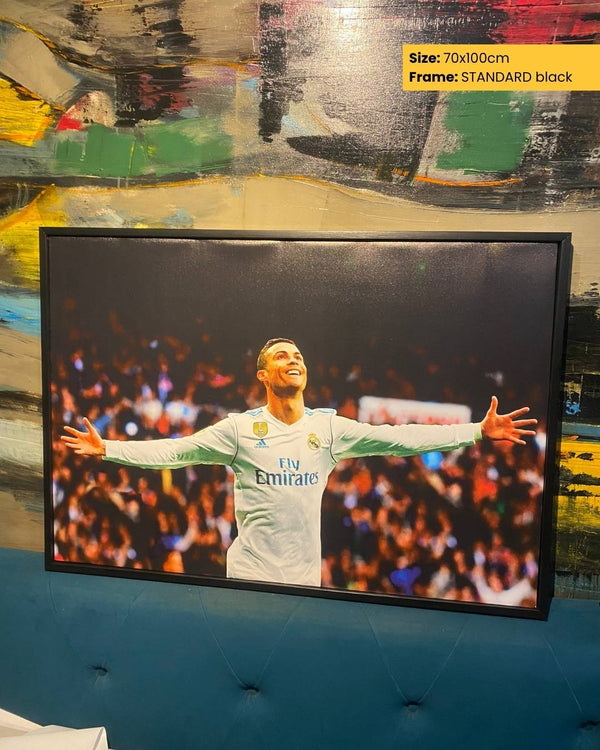 Framed picture of a soccer player with a colorful background
