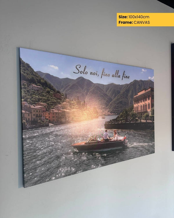 Canvas print of a scenic lake with mountains and a boat, featuring the text 'Solo noi, fino alla fine'.