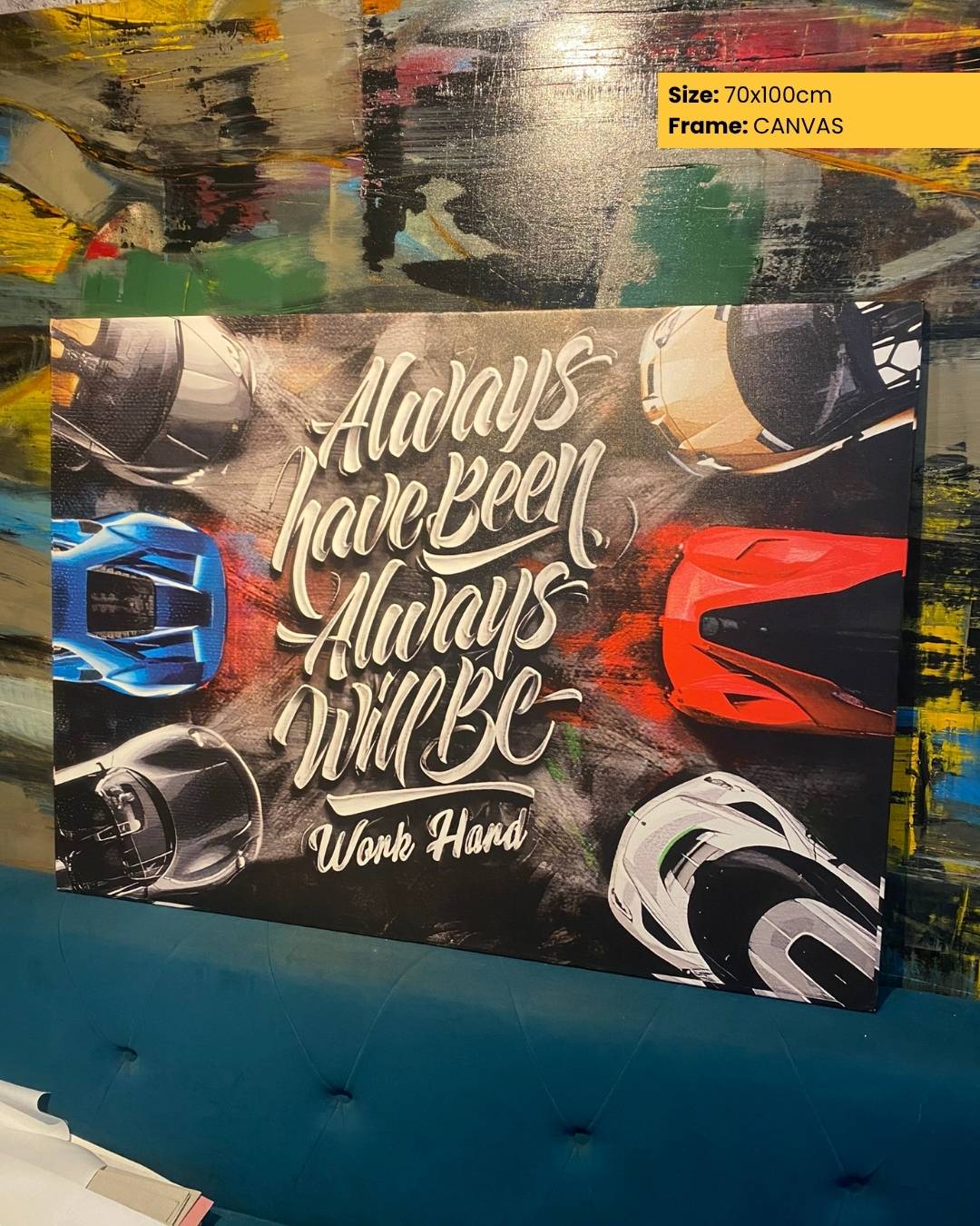Canvas print with helmets and text 'Always have been, always will be, work hard' on a colorful background.