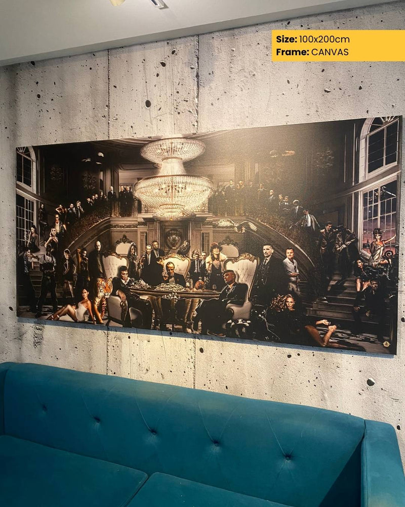 Large canvas print of a historical scene with people around a table, displayed on a wall above a blue sofa.