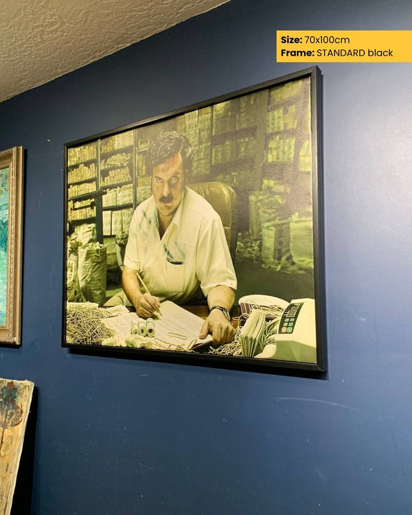 Framed picture of a man in a store on a blue wall