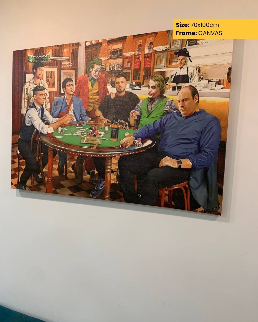 Canvas print of a poker game scene with multiple people around a table, framed on a wall.