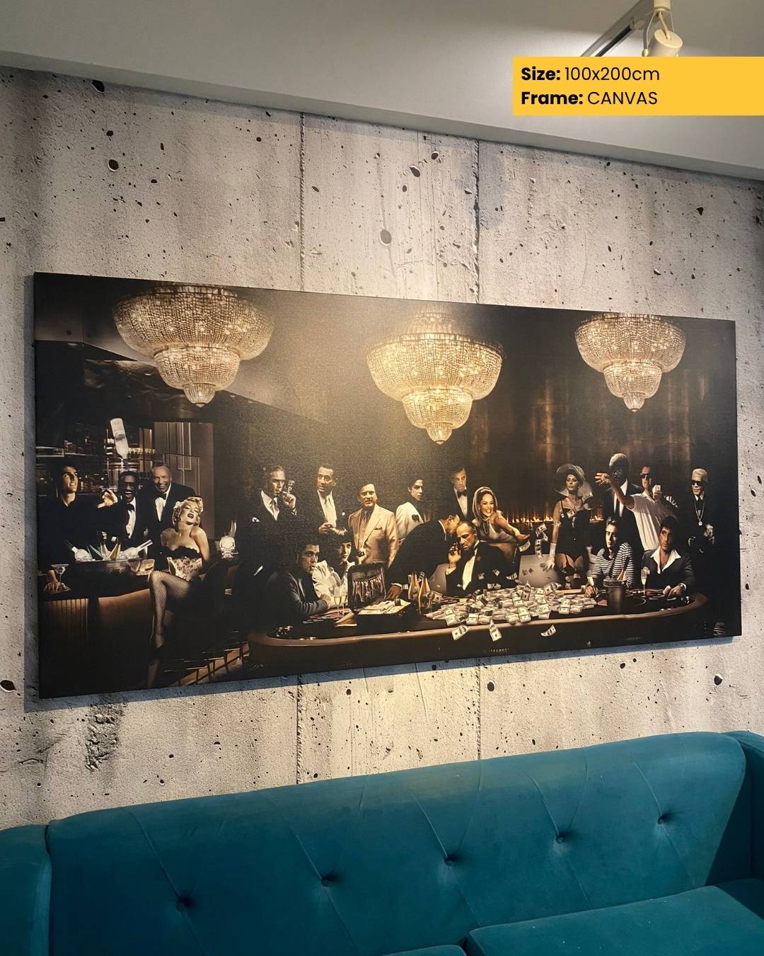 Large canvas print of a social gathering with chandeliers, displayed on a textured wall above a blue sofa.