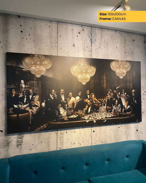 Large canvas print of a social gathering with chandeliers, displayed on a textured wall above a blue sofa.