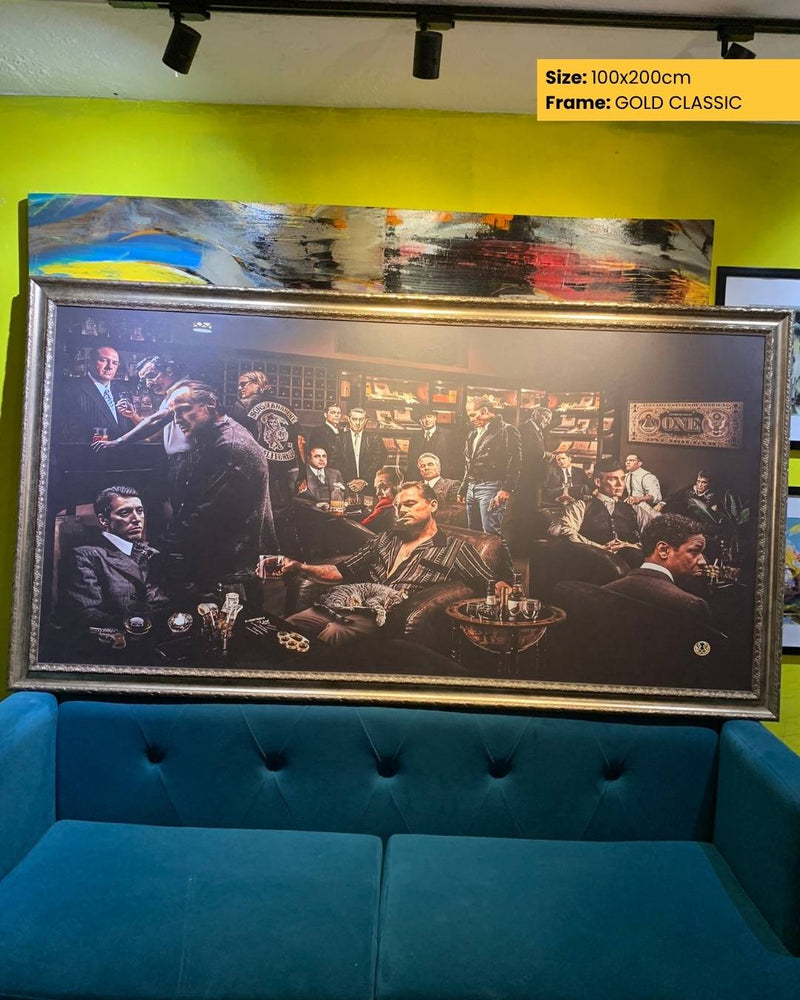 Framed artwork of a group of men in a room with a blue couch and yellow wall.