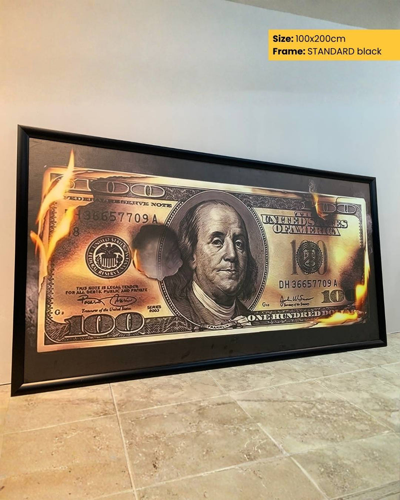 Framed print of a $100 bill on a wall