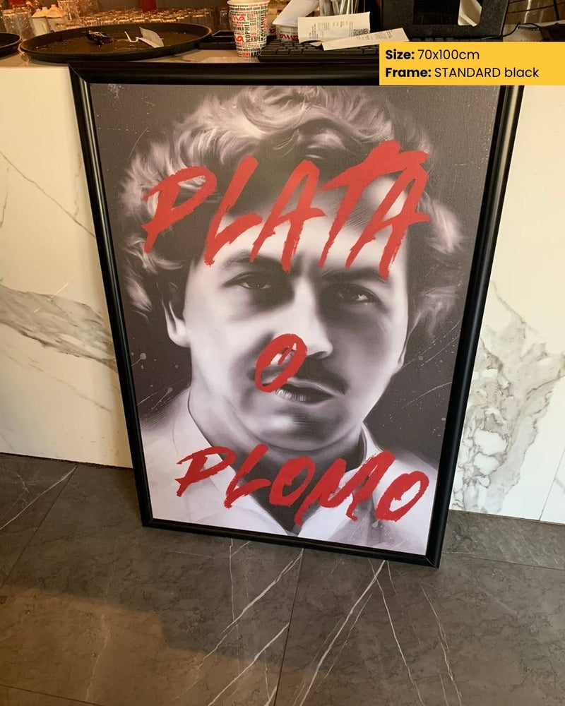 Framed poster with a black and white portrait and red text on a marble surface.