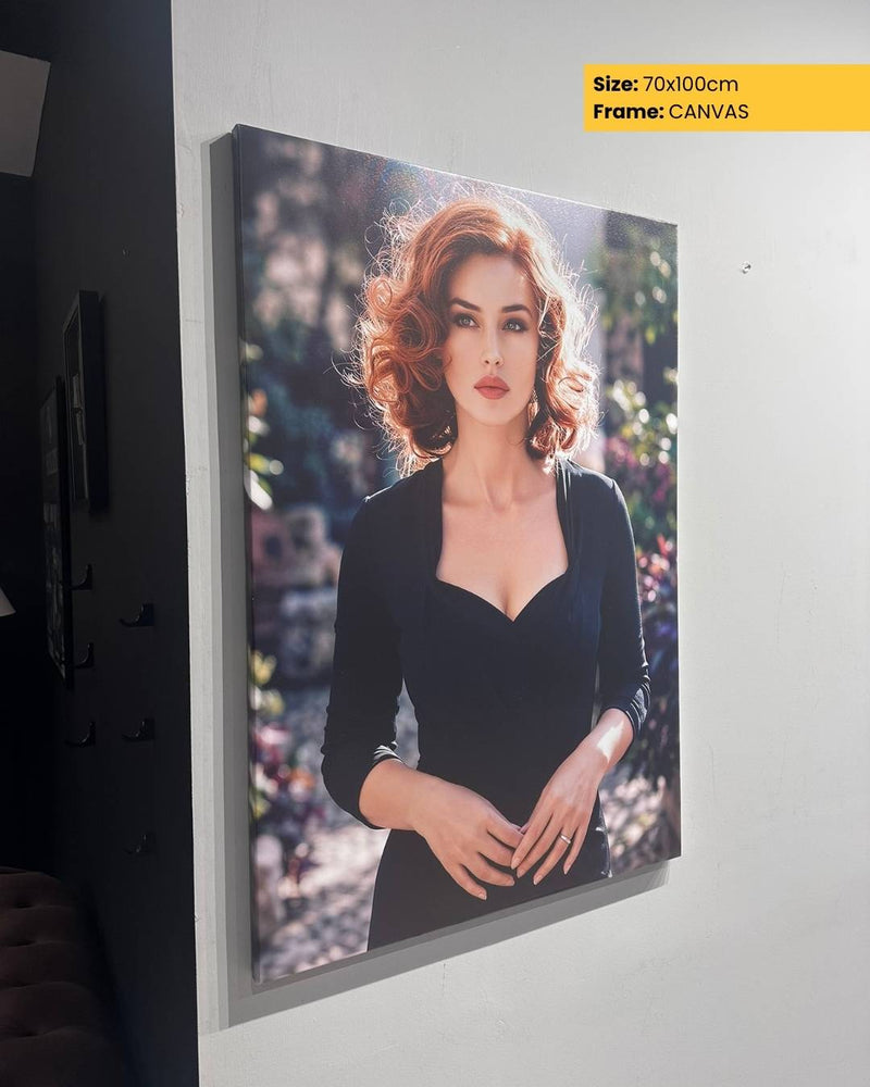 Canvas print of a woman with red hair on a wall, size 70x100cm.