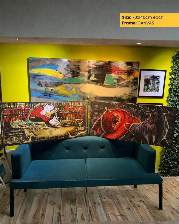 Teal sofa in a room with colorful abstract paintings on a yellow wall.