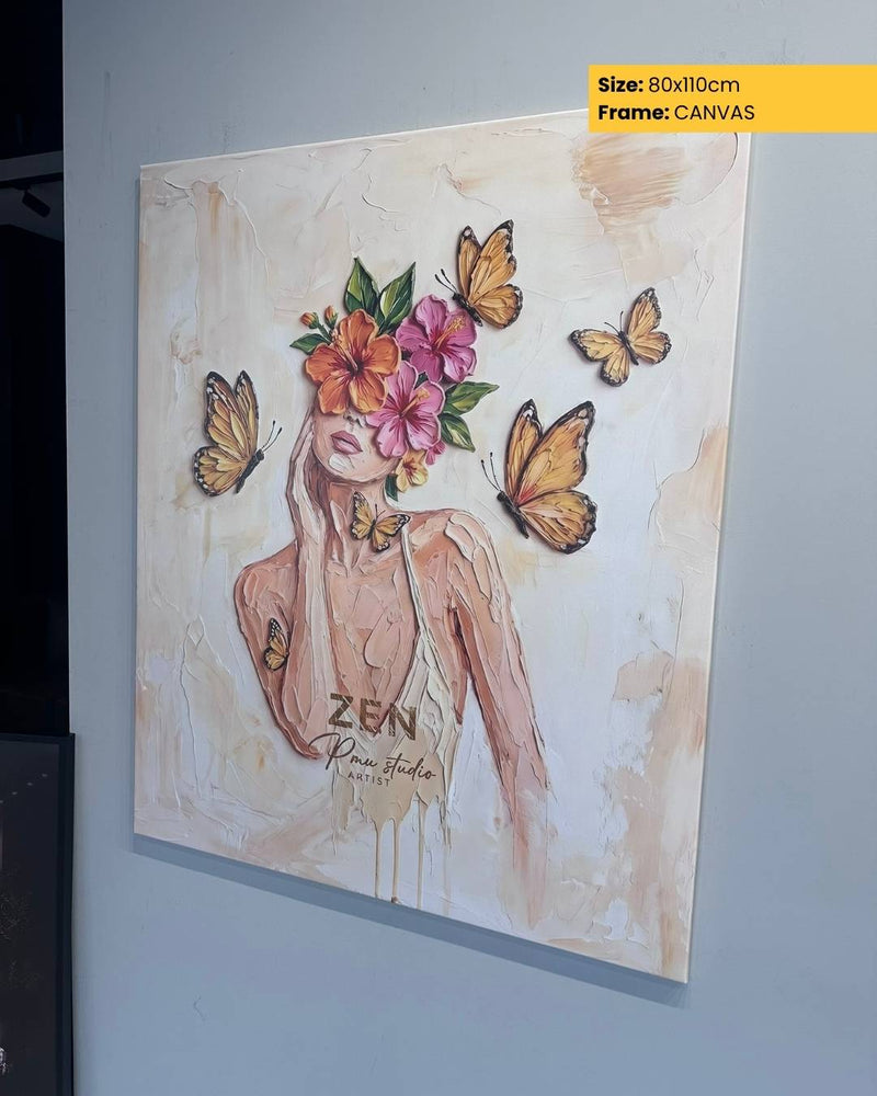 Canvas print of a woman with flowers and butterflies on a plain wall.
