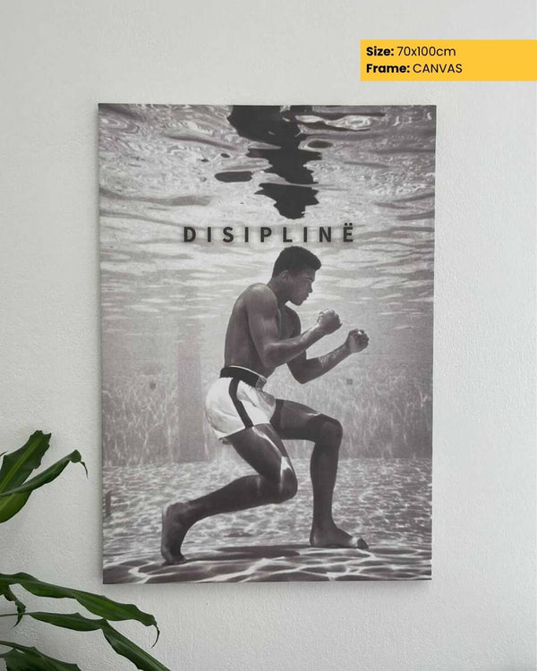 Canvas print of a boxer in water with 'DISIPLINE' text, displayed on a wall.
