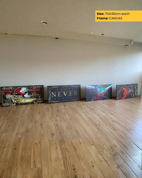 Four canvases of different sizes and designs on a wooden floor with a plain wall background.