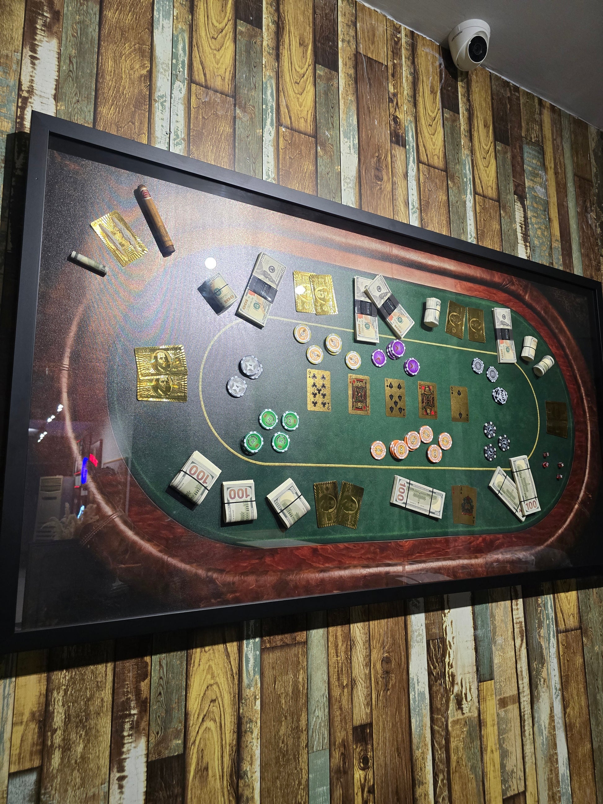 Casino table with chips and cards on a wooden wall background