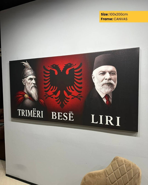 Canvas print with Albanian symbols and text on a wall.