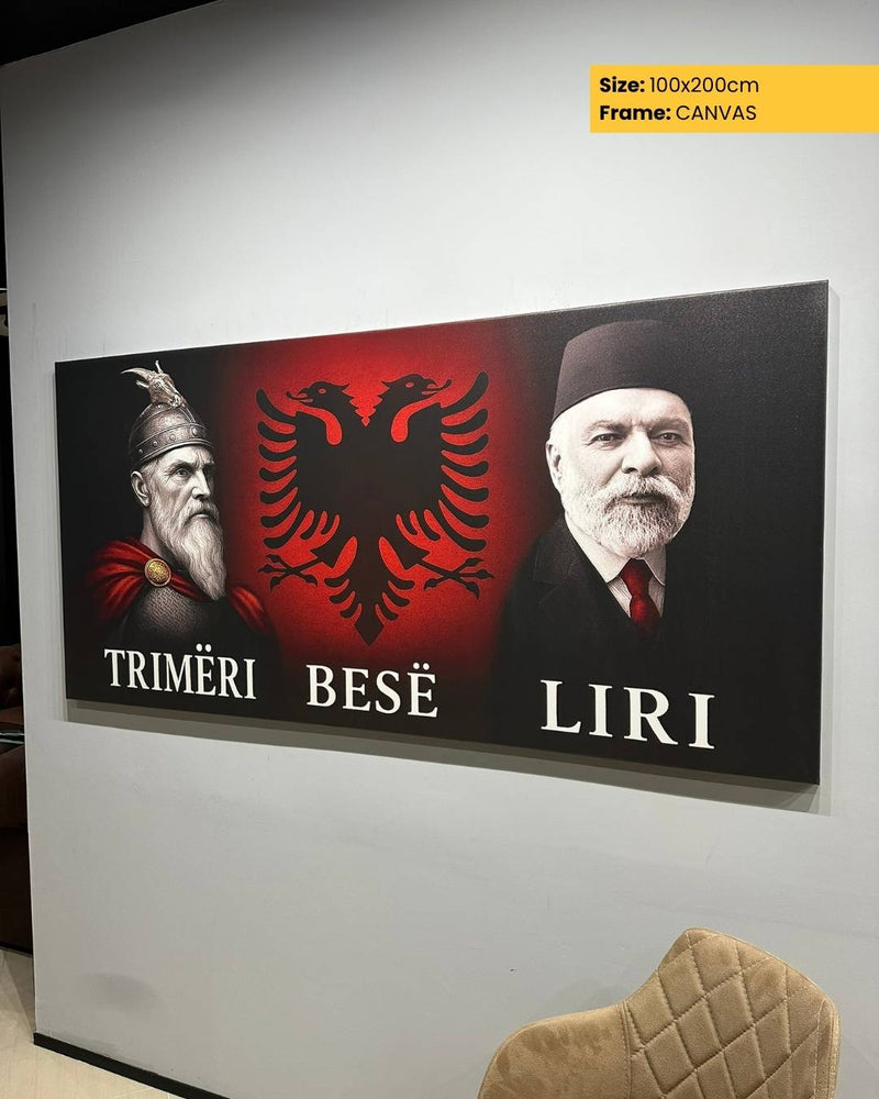 Canvas print with Albanian symbols and text on a wall.