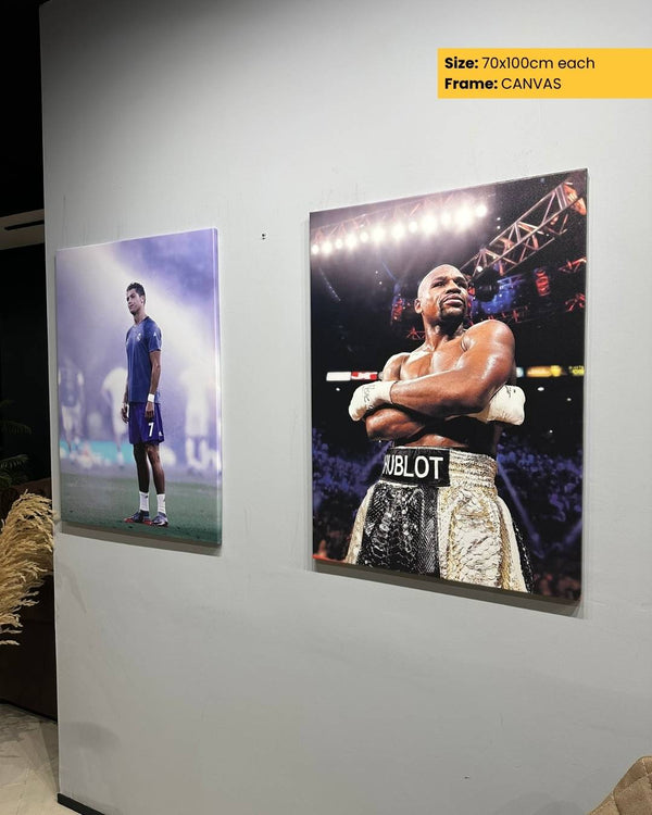 Two boxing-themed posters on a wall, one featuring a boxer and the other a sports player, with a 'CANVAS' frame option displayed.