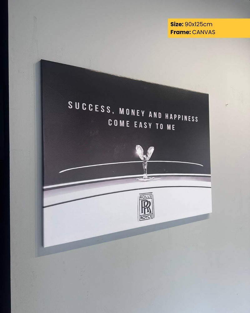 Canvas print with a Rolls-Royce logo and text on a gray wall.