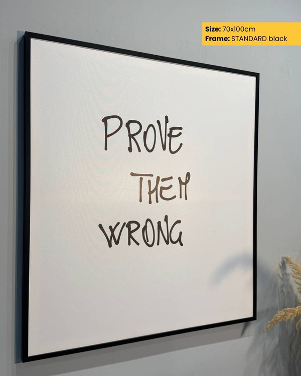 Framed poster with 'Prove Them Wrong' text on a white background