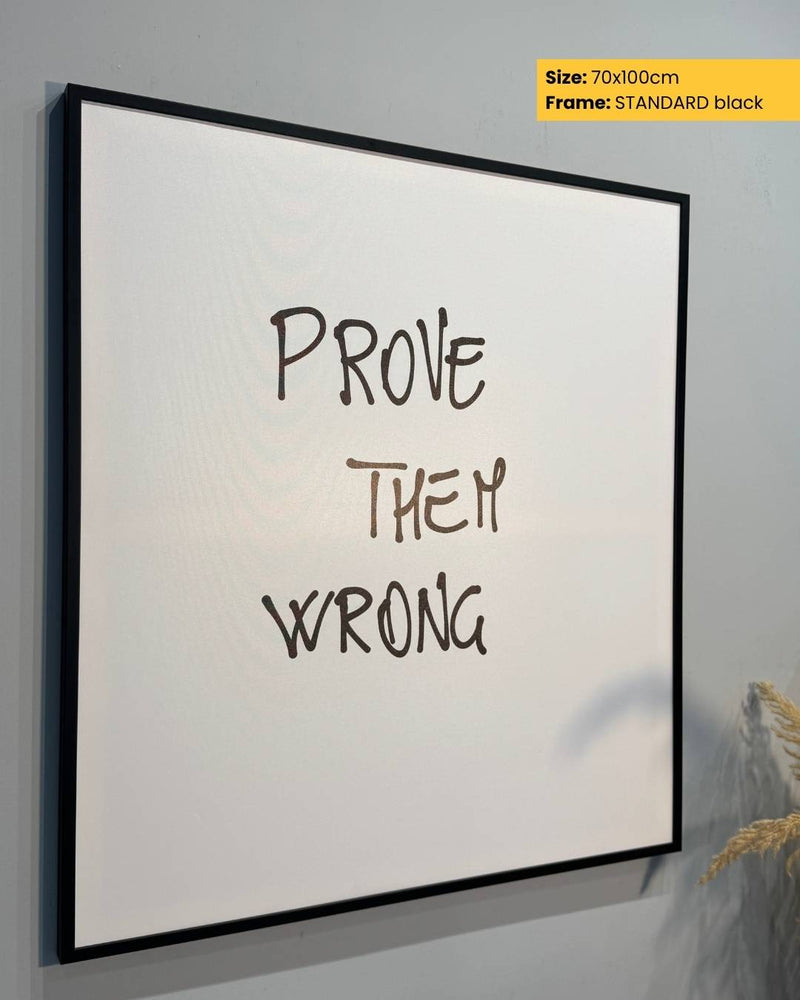 Framed poster with 'Prove Them Wrong' text on a white background