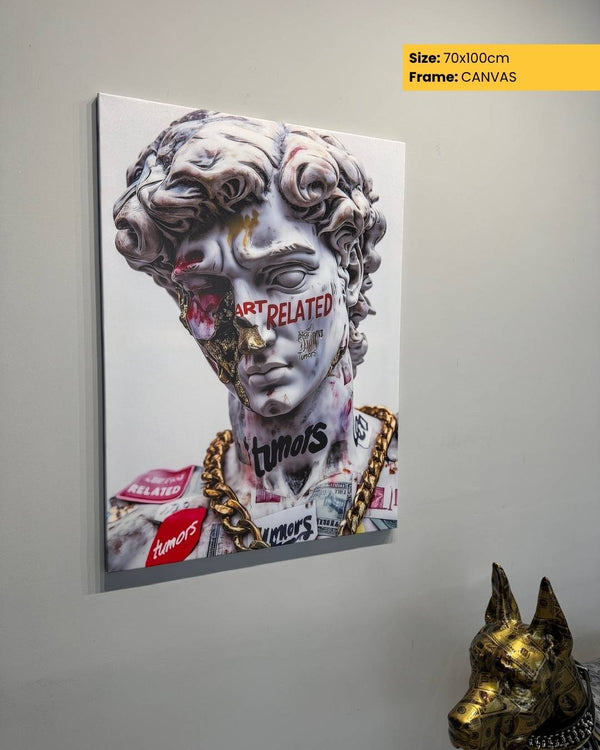 Canvas print of a stylized sculpture with text on a gray wall, featuring a gold dog statue.