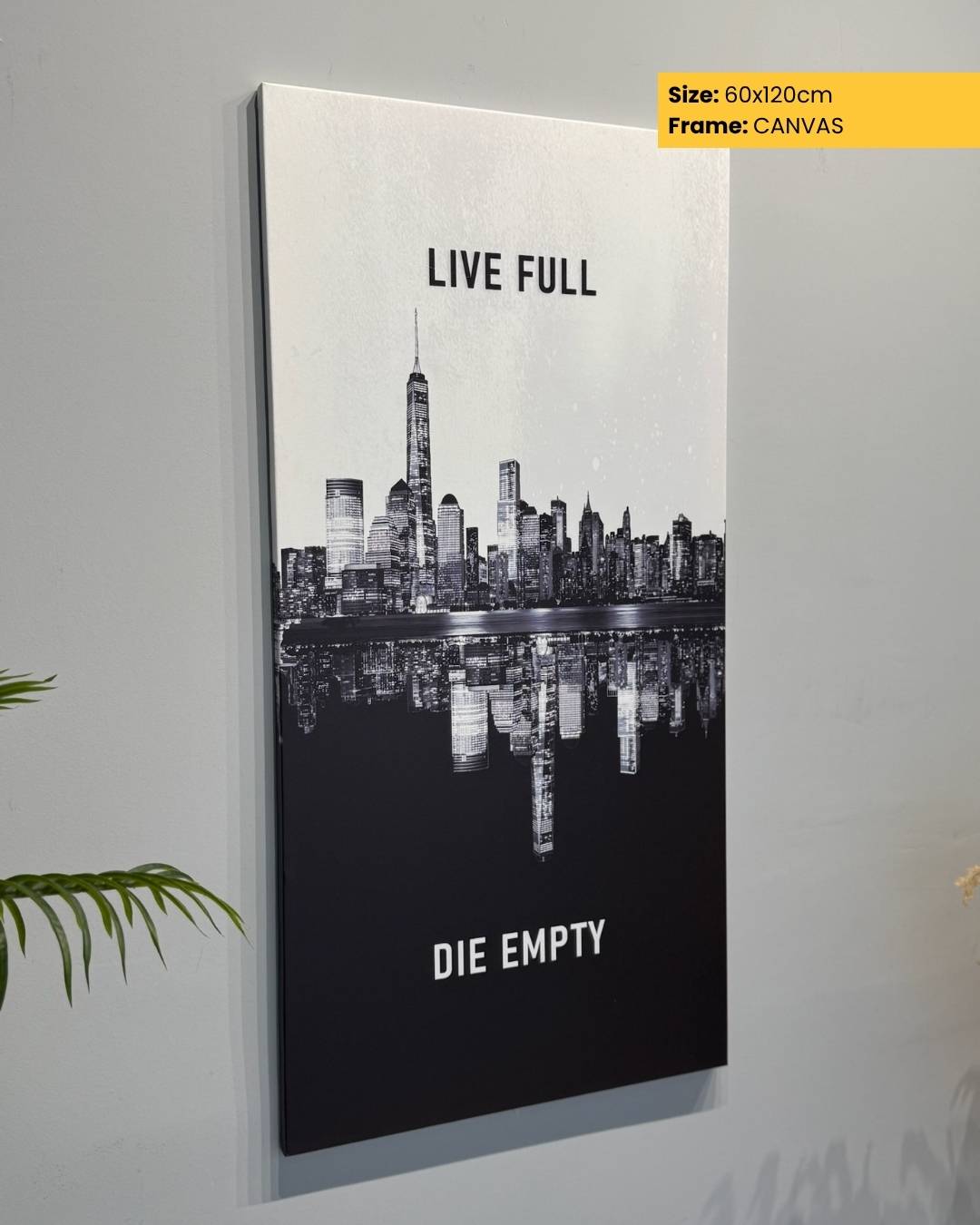 Canvas print of a city skyline with motivational text on a wall.