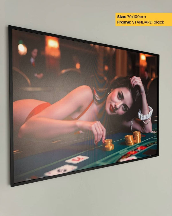 Framed artwork of a woman at a casino table on a wall.