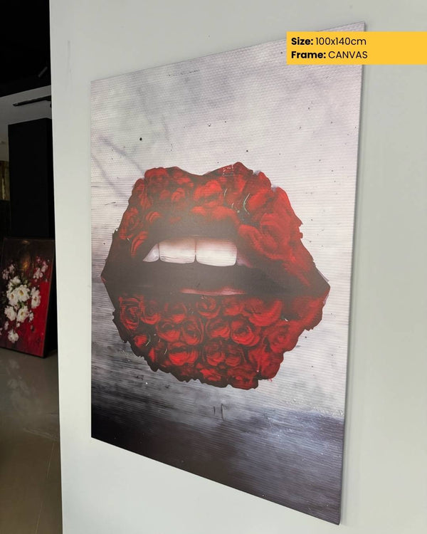 Canvas print of a graphic design with red roses and lips on a gray background, displayed on a wall.