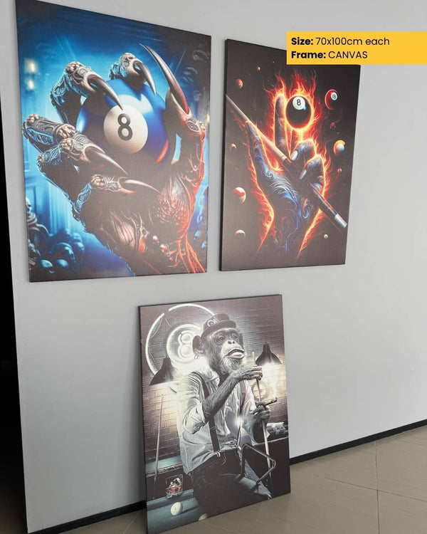 Three artistic posters on a wall, featuring different designs and sizes.