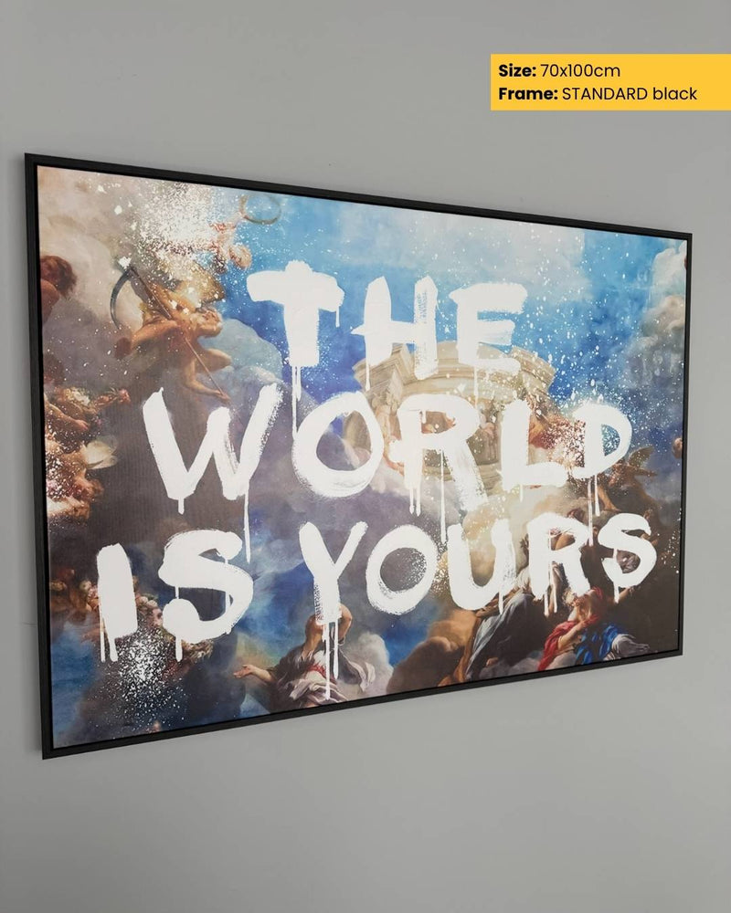 Framed artwork with 'The World is Yours' text on a gray wall