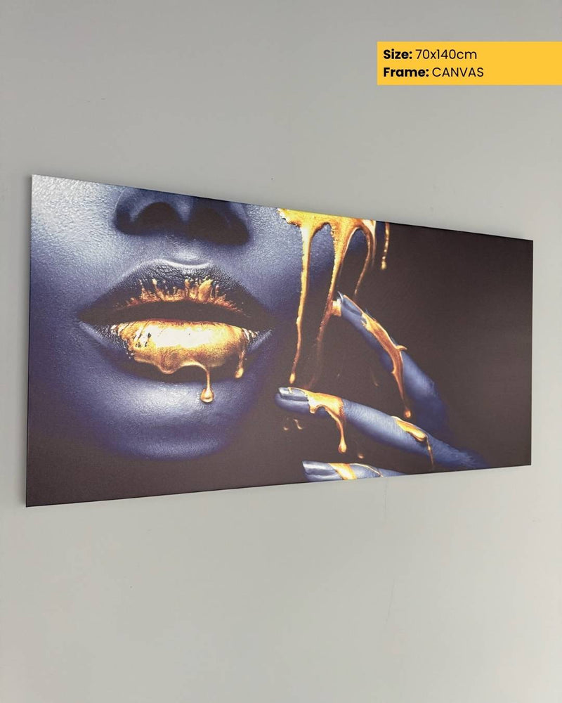Canvas print of a artistic depiction of a face with gold liquid on a gray wall.