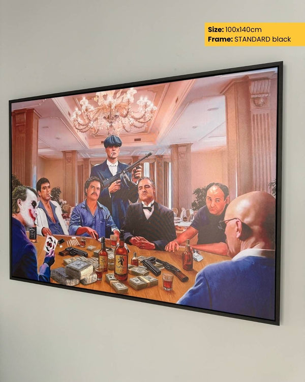 Framed artwork of a group of men around a table with drinks and money, on a white wall.
