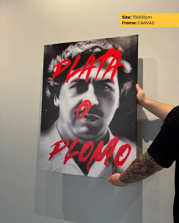 Person holding a poster with a black and white portrait and red text on a light gray background