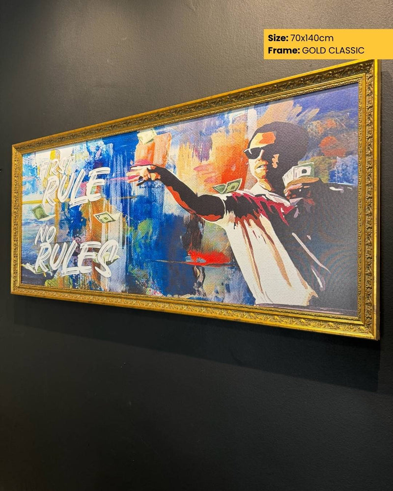 Framed artwork with a stylized figure and text on a dark wall.