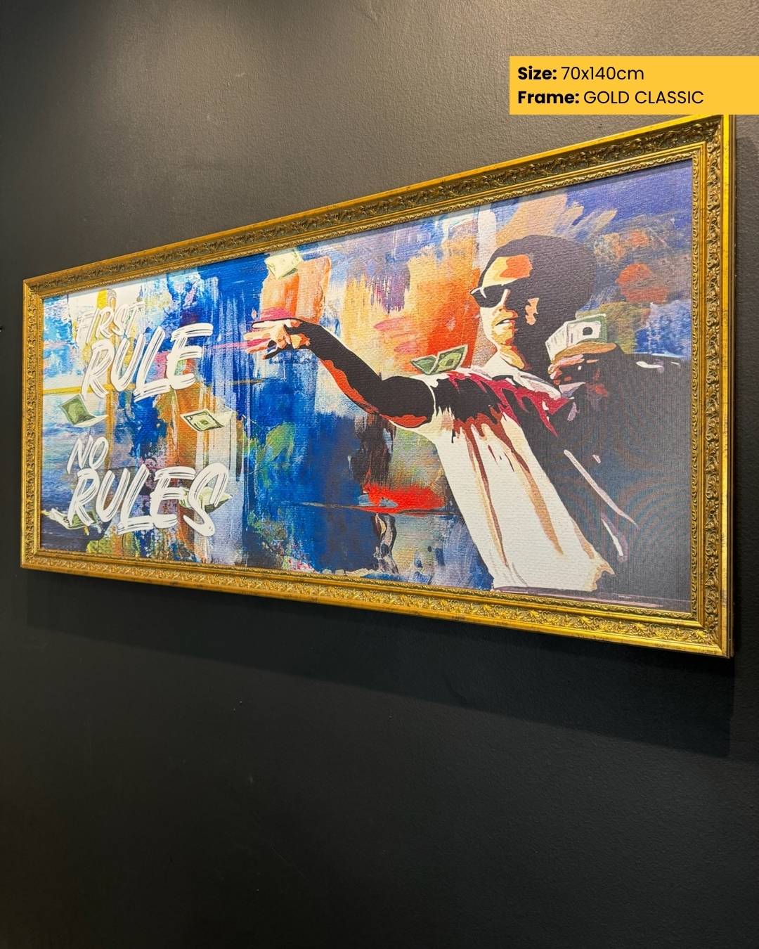 Framed artwork with a stylized figure and text on a dark wall.