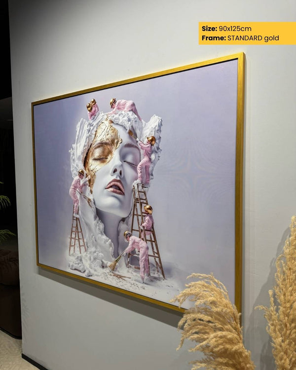 Framed artwork with a gold frame on a wall