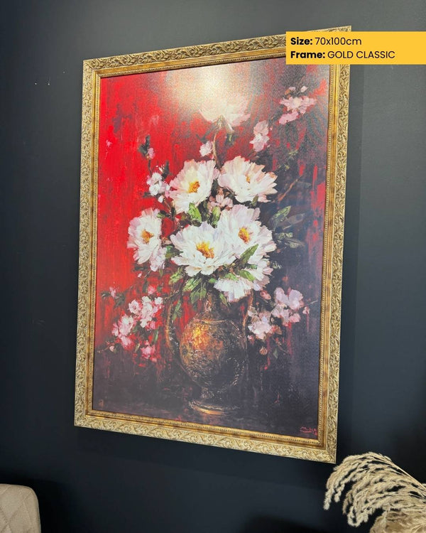 Framed painting of flowers on a red background with gold frame