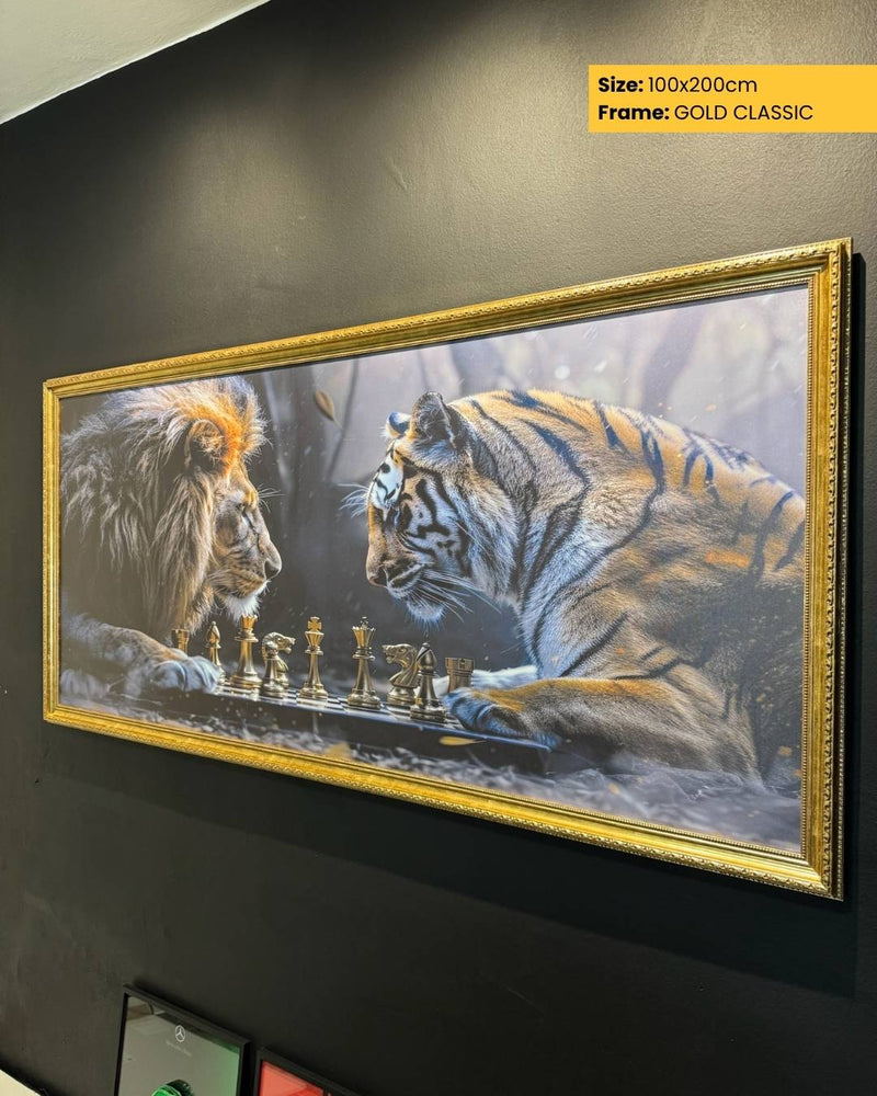 Framed artwork of a lion and tiger playing chess on a dark wall.