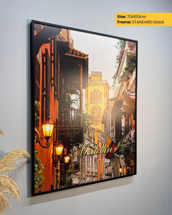 Framed artwork of a city street scene with 'Naples' text, on a light gray background.