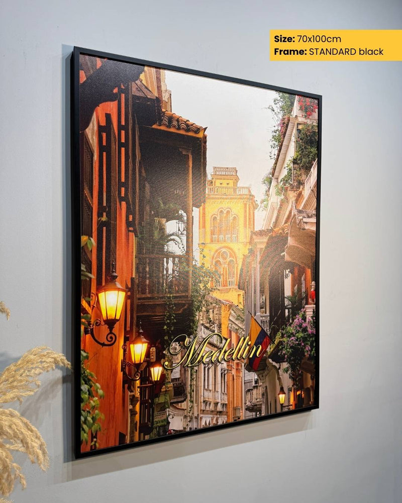 Framed artwork of a city street scene with 'Naples' text, on a light gray background.