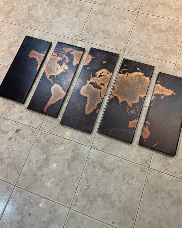 Five world map tiles on a tiled floor