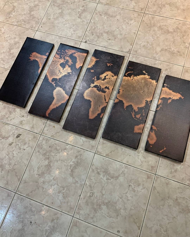 Five world map tiles on a tiled floor