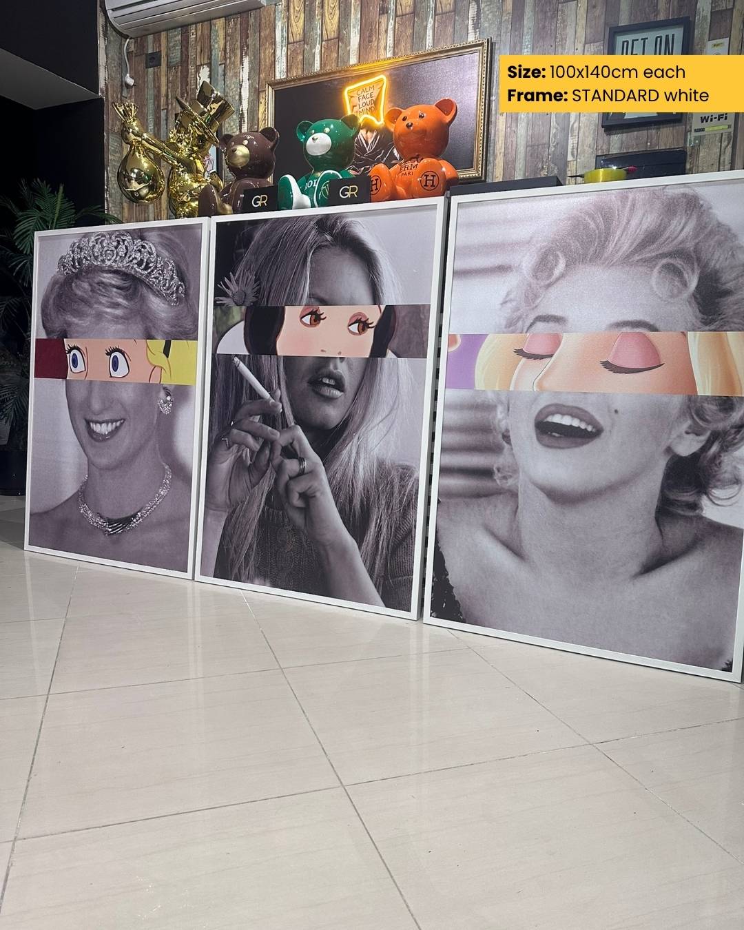 Three framed black and white portraits with colorful visors on a tiled floor.