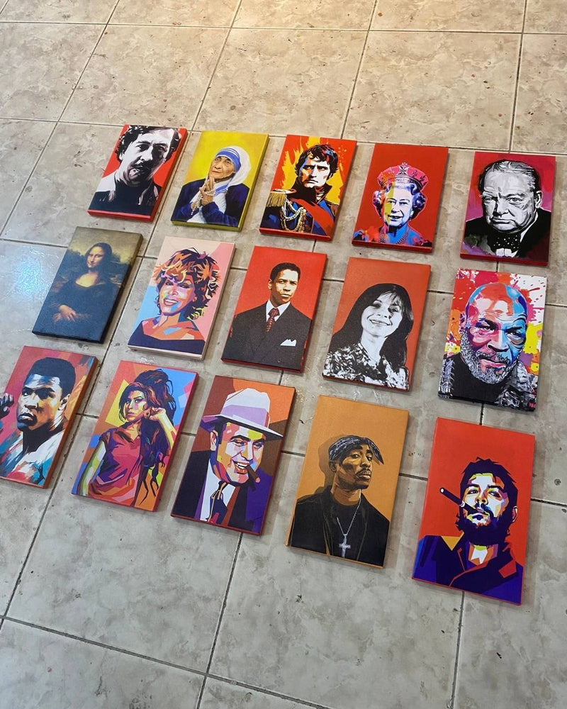 Collection of colorful portrait paintings on a tiled floor