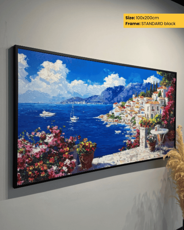 Large framed painting of a coastal scene with mountains and flowers on a wall.