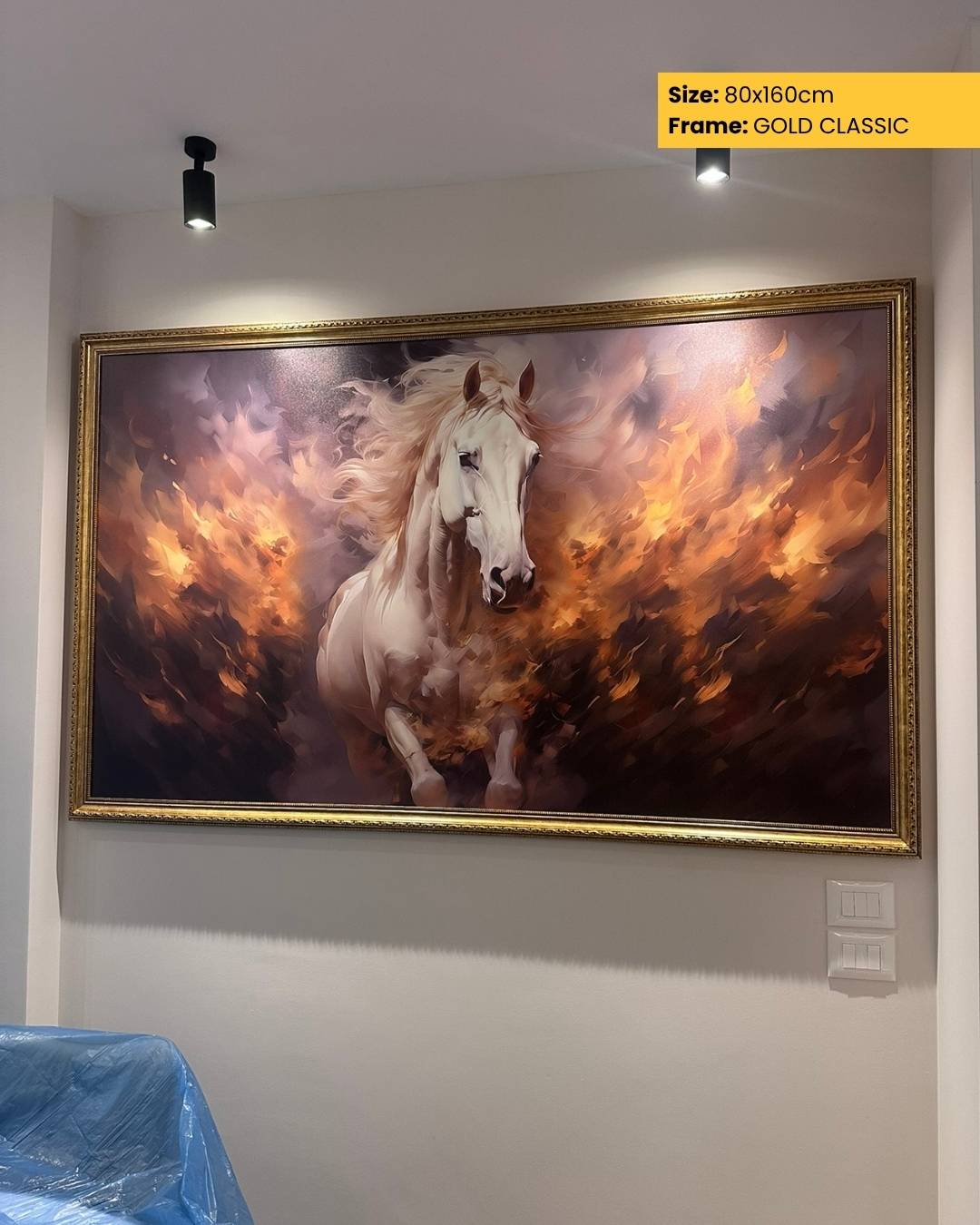 Framed artwork of a horse on a wall with gold frame