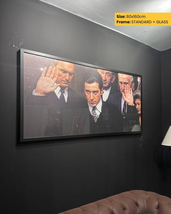 Framed artwork of a man with his hand over his ear on a dark wall.