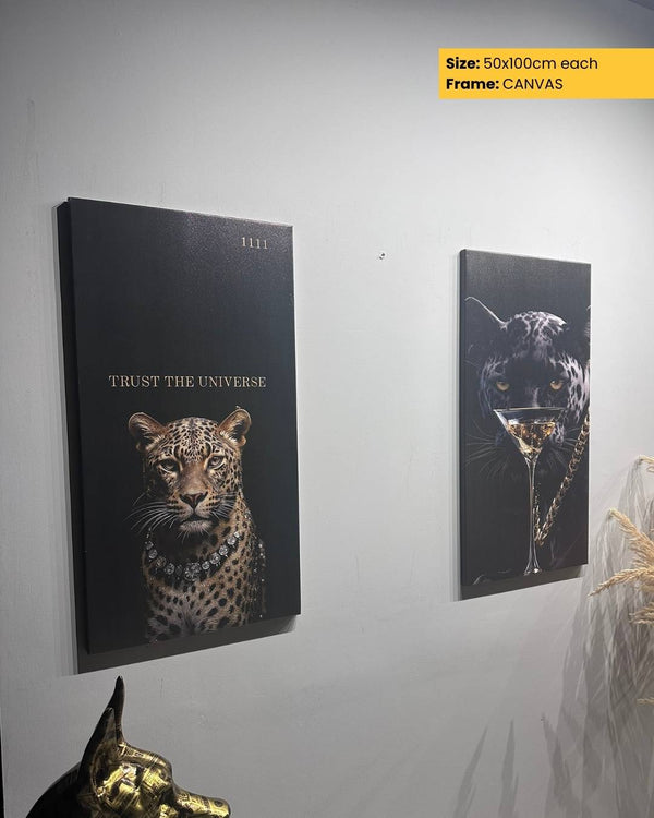 Two wall art pieces featuring leopards on a white wall.