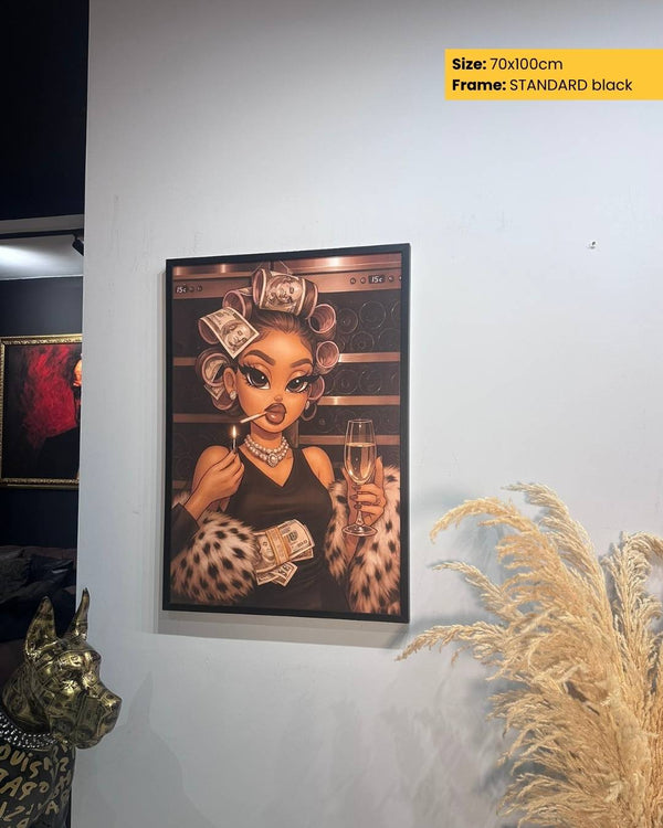 Framed artwork of a woman with money in her hair on a wall.